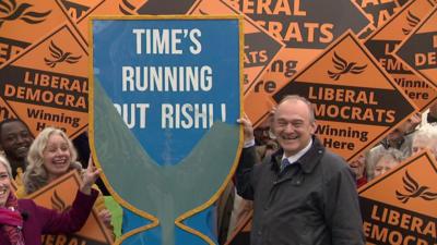 Ed Davey with egg timer at election launch