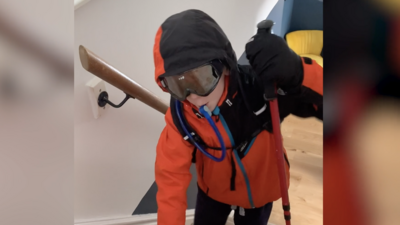 child-climbing-stairs-wearing-hiking-gear