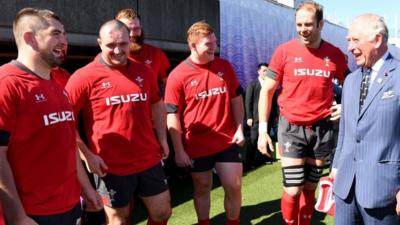 Prince Charles talks to Wales squad members (L-R) Wyn Jones, Ken Owens, Jake Ball (obscured), Rhys Carre and Alun Wyn Jones