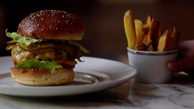 A shot of the €20 burger with a side of chips