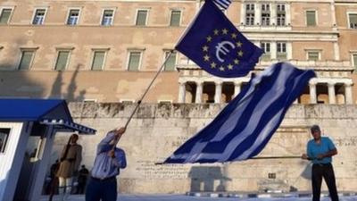 Flags waved outside parliament in Greece