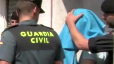 Suspect arrested in Ripoll has face covered with blanket