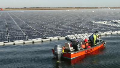 Boat at giant solar farm