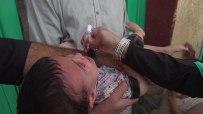 Child being given polio vaccine