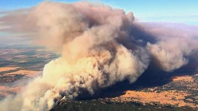 Smoke billows over California's Napa Valley wine country.