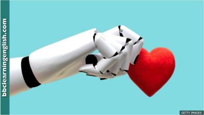 a robot's hand holding a heart