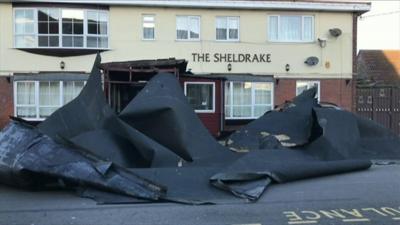 the roof blown off a pub