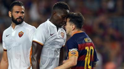 Lionel Messi and Mapou Yanga-Mbiwa clash