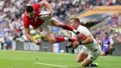 Josh Adams upended by Freddie Steward