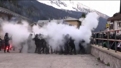 police in cloud of tear gas