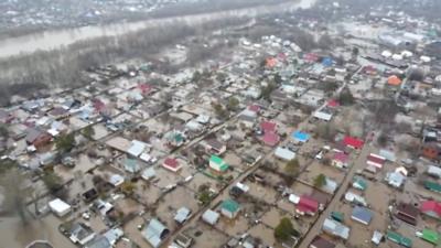 Homes and roads submerged in floodwaters