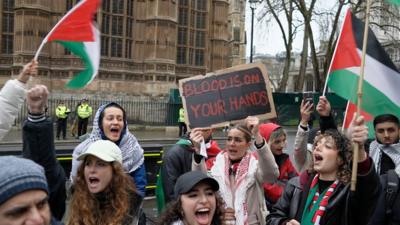 People queue outside Parliament