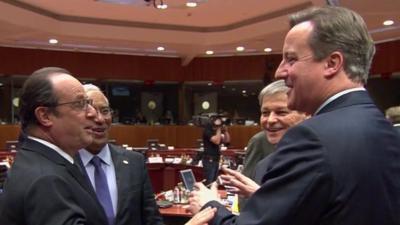 French President Hollande jokes with David Cameron