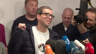 Jens Söring is cheered as he arrives in Germany