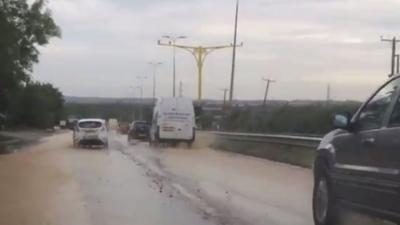 The A127 near Rayleigh in Essex is under a foot of water in places.