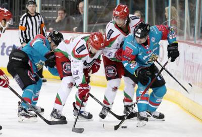 action from Belfast Giants against Cardiff Devils