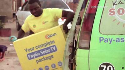 An Azuri solar satellite TV delivery man