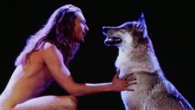 Man singing to a wolf