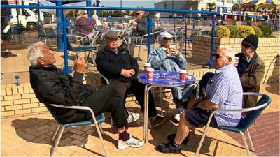 People outside a cafe in Barry