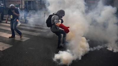 Man amid tear gas in Paris