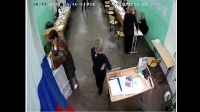 Ballot papers being stuffed into a voting box