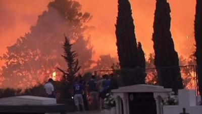 Residents watch as fires approach Split