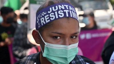 A protester from El Salvador looking at the camera