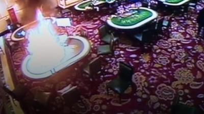 CCTV footage shows the gunman setting fire to casino tables