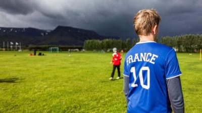 Boy wearing France T shirt in Reykjavik