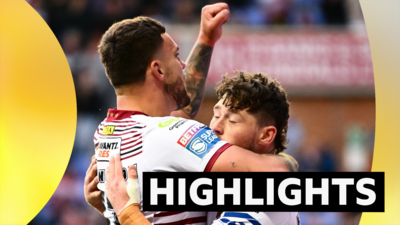 Jack Farrimond of Wigan celebrating his try with Oliver Partington