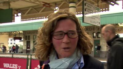 Woman leaving train station