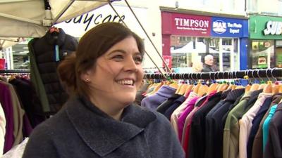 Woman at a clothes stall