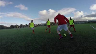 Men playing football