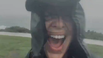 Woman laughing in the rain