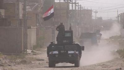 Military vehicle with Iraq flag