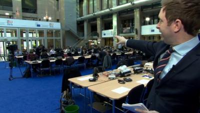 The BBC's Ben Wright in the media centre of the European Council