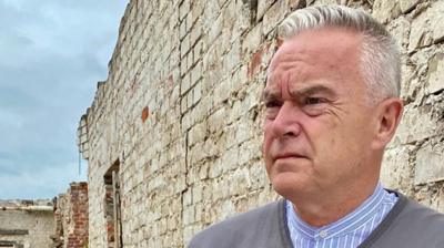 BBC newsreader and presenter Huw Edwards visits the remains of the German POW camp where his grandfather was held.