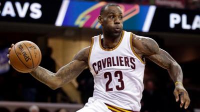 LeBron James looks to pass against the Phoenix Suns during the first half of an NBA basketball game Wednesday, Jan. 27, 2016, in Cleveland.