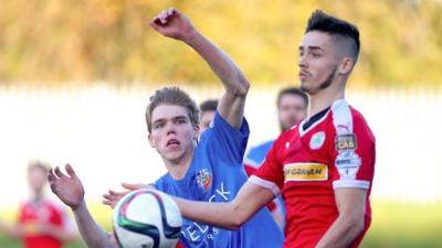 Cliftonville's Jay Donnelly and Glenavon's Rhys Marshall in action at Solitude.