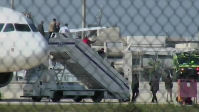 Passengers leave plane