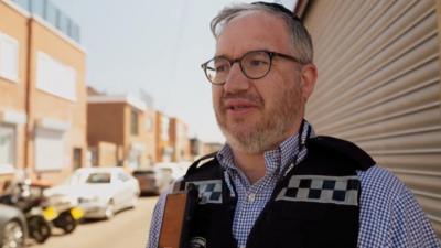 Isaac wearing a volunteer Shomrim vest