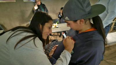 Nadia Nadim signs a girl's shirt