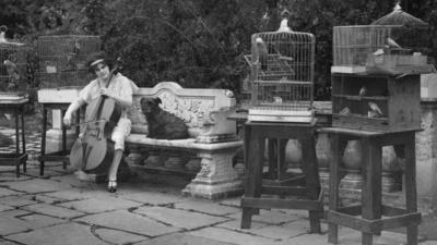 Beatrice in garden with her cages