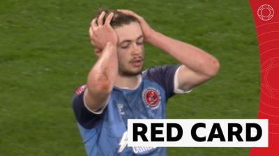 Cain Hayes walks after being shown a red car against Burnley in the FA Cup