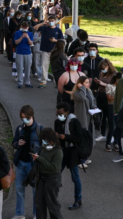 Students queuing in masks