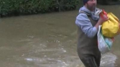 Man wading through water in York