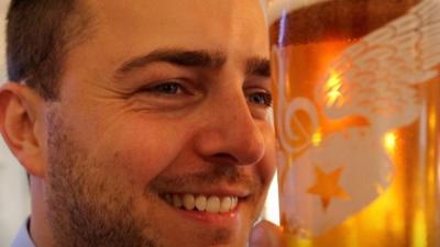 Ross O'Hara holding a pint of beer