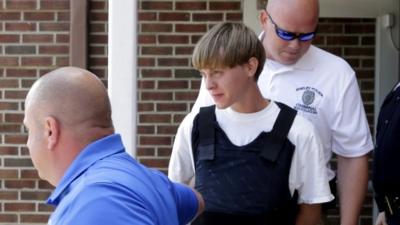 Dylann Roof centre) escorted from Shelby police station