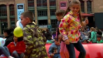 Children on bouncy inflatable at a party