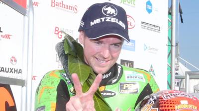 Alastair Seeley celebrates after becoming the most successful rider in North West 200 history